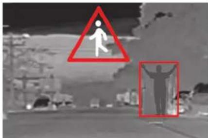 Street photo showing pedestrian crossing warning sign with red triangle and silhouette of person lifting head, next to a building with trees.