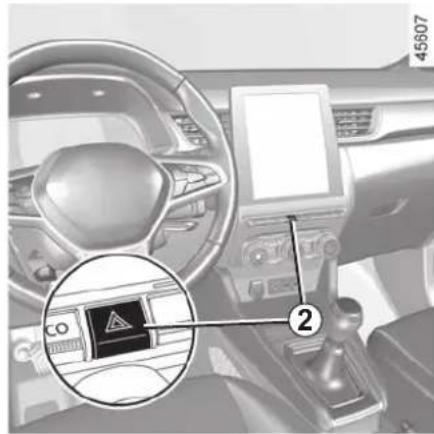 Car interior view with a warning sign and numbered annotation highlighting a hazard symbol in the dashboard