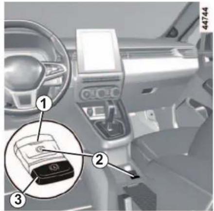 Car interior diagram with numbered parts highlighting a battery compartment and a lock mechanism
