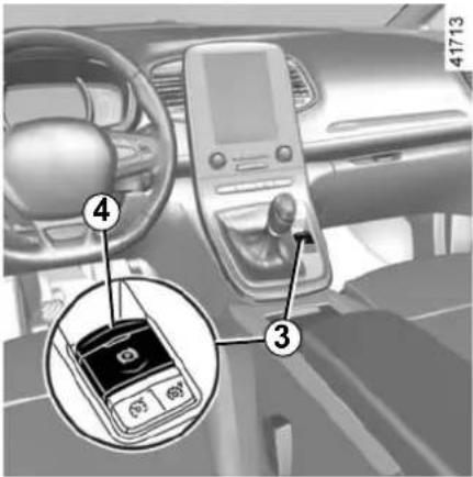 Interior view of a car dashboard with labeled parts including a rotary keypad and a digital display, showing numbered annotations.