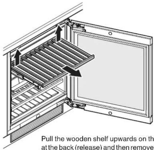 Pull the wooden shelf upwards on th at the back (release) and then remove