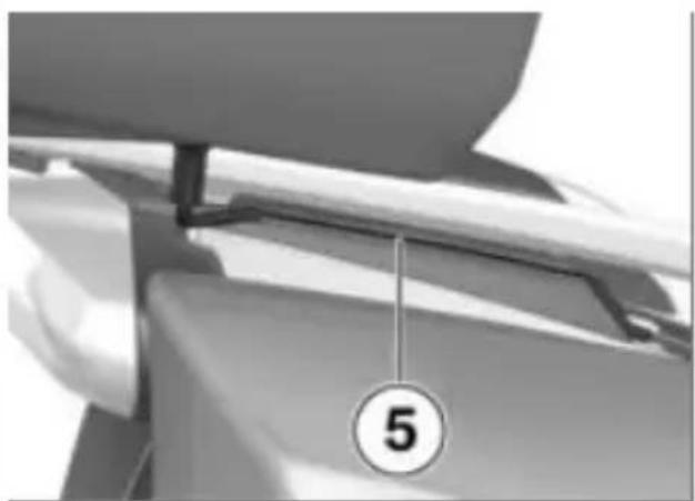 Close-up of a mechanical component with a numbered circle marker (5) and a vertical line, no readable text or symbols beyond the number.