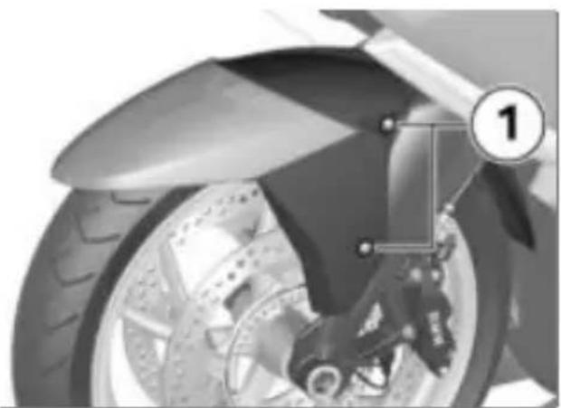 Close-up of a motorcycle wheel and brake system with visible components (no text or symbols)