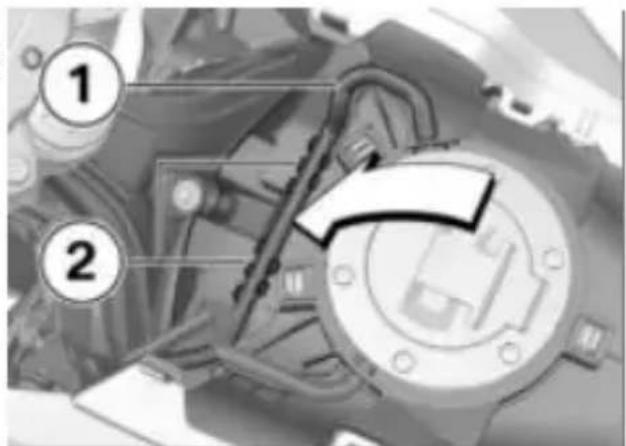 Technical diagram showing mechanical components with numbered annotations 1 and 2 pointing to specific parts.