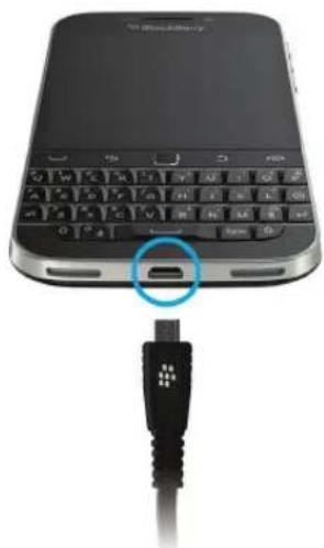 Close-up of a black Bluetooth device with an attached black cable showing the connector (no text or symbols visible)