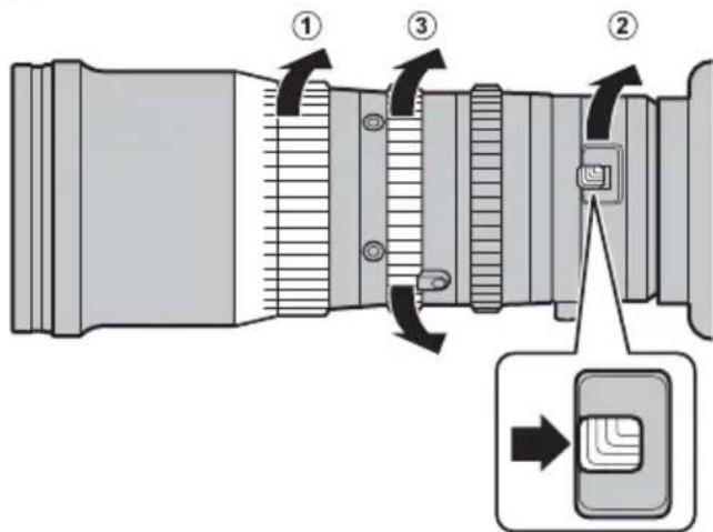 Diagram of a camera lens assembly with numbered parts and directional arrows indicating motion or adjustment.