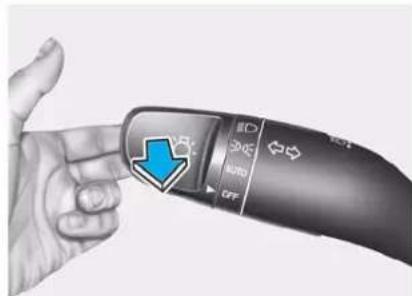 Hand gesture pointing to a device with control buttons labeled 'AUTO', 'OFF', and 'VR', featuring a blue arrow pointing to the button.
