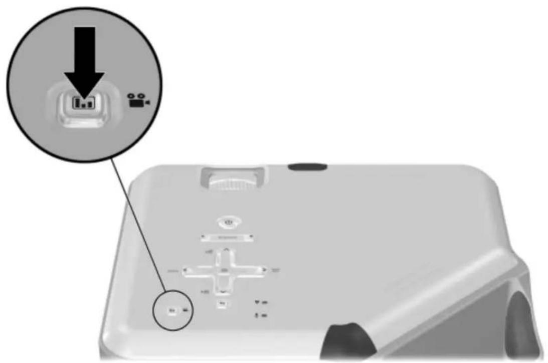 Diagram showing a device with a labeled button and directional arrow, indicating a process or operation.