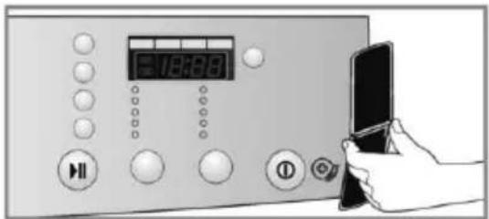 Diagram showing a digital display with time and control buttons, connected to a hand holding a tablet device.
