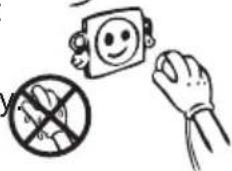 Safety warning illustration showing a smiling face on a device, a crossed-out hand holding a prohibition symbol, and a hand holding a ball.