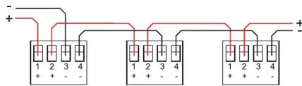 Electrical circuit diagram showing three identical components with labeled terminals and red lines indicating connections