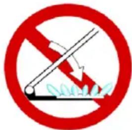 Prohibition sign with red circle and diagonal line crossing over leafy ground, indicating no litter or trash.