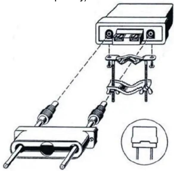 Diagram of a mechanical or electrical device assembly with two connected components and a spring-like structure, no visible text or symbols.