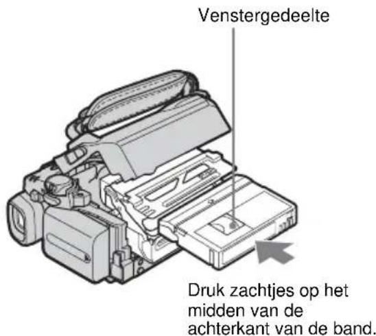 Venstergedeelte Druk zachtjes op het midden van de achterkant van de band.