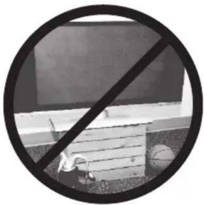 Black and white circular sign with a diagonal line crossing over a building, no text or symbols present.