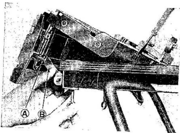 Technical diagram of a mechanical device with labeled parts A and B, showing structural components and connections.