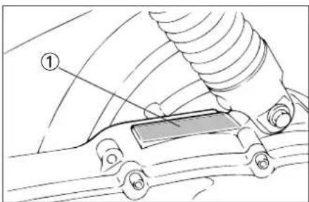 Technical diagram showing a car with labeled parts, including a numbered annotation (①) pointing to a component.