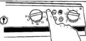 Hand pointing at a control panel with multiple rotary dials and a dial indicator showing 100%.