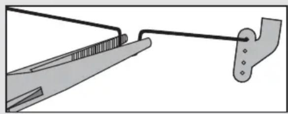 Diagram of a tool interacting with a mechanical component, showing a handle and base (no text or symbols)