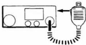 Diagram showing a device connected to a device with a plug, indicating electrical or signal connection.