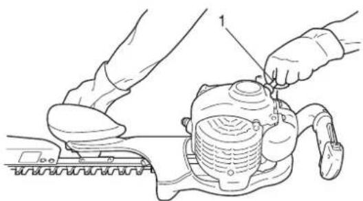Illustration of hands operating a mechanical device with a brush (no text or symbols visible)