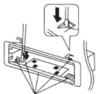 Technical diagram showing a mechanical assembly with directional arrows and a magnified detail view highlighting a specific component.