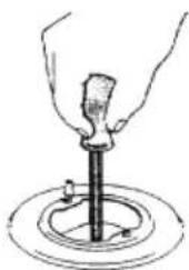 Illustration of a hand using a tool to press or install a mechanical component, with no visible text or symbols.