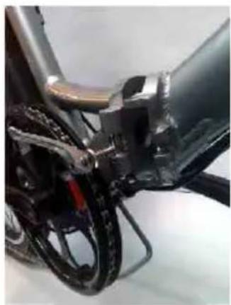 Close-up of a bicycle's front wheel and side panel, showing mechanical components and wiring (no text or symbols visible)