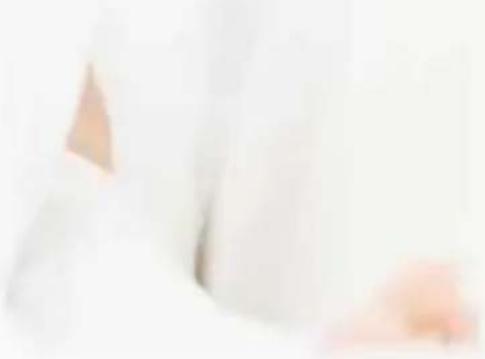 Close-up of a person's arm and shoulder area, no visible text or symbols