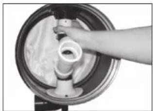 Close-up of a hand pouring liquid into a circular container (no text or symbols visible)