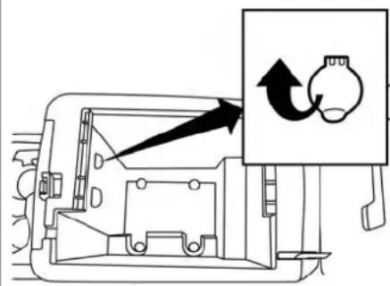 Diagram showing a device interior with a labeled component and directional arrow indicating rotation or movement.