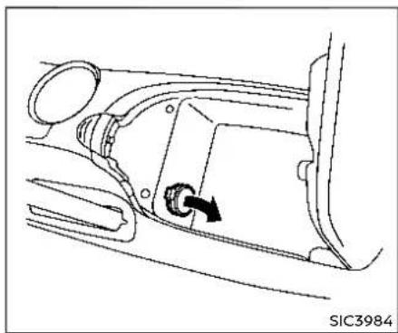 Technical line drawing of a car interior showing a directional arrow and component detail (no text or symbols)