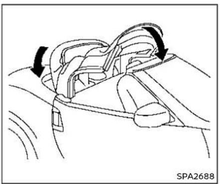 Diagram of a car interior showing a seatbelt mechanism with arrows indicating direction (no text or symbols)