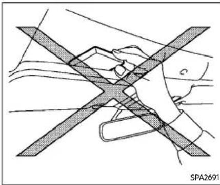 Diagram of a hand holding a car seatbelt with diagonal band crossing (no text or symbols)