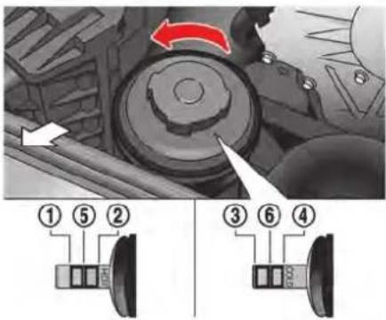 Diagram showing mechanical components with numbered parts and directional arrows, likely illustrating a system or assembly process.