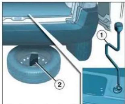 Diagram showing mechanical assembly with labeled parts, including a tool and a valve mechanism