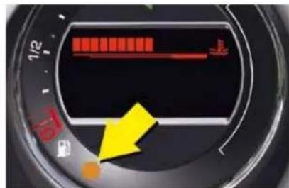 Close-up of a camera speedometer dial showing red and orange indicators with a yellow arrow pointing to a specific speed value.