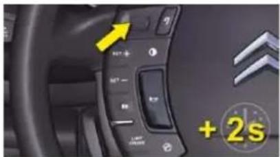 Car dashboard control panel with Chinese and English labels, showing speed limit indicator and +2s annotation
