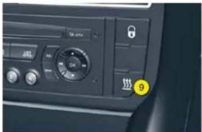 Car infotainment panel with status bar, speedometer, and lock icon, showing a yellow badge labeled '9'