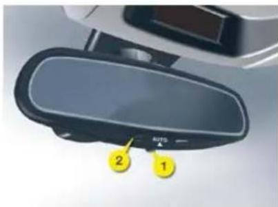 Diagram of a car rearview mirror with labeled parts 1 and 2, showing a blue screen and yellow directional arrow.