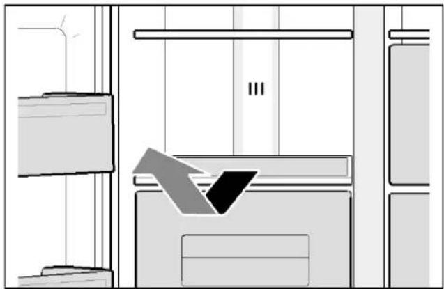 Interior view of a room with furniture and a window, showing a directional arrow pointing to a window (no text or symbols present)