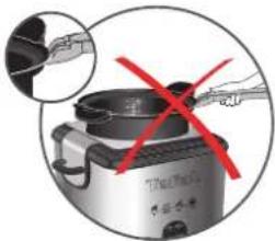 Diagram showing a cooking appliance with red prohibition signs, indicating resistance or rejection.