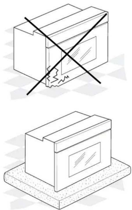 Two technical illustrations of a cardboard box with a crosshair and warning symbol (no text or labels)