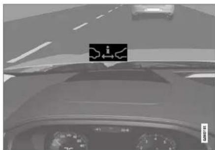 Car dashboard view with visible road sign and speedometer, showing vehicle ahead and lane markings