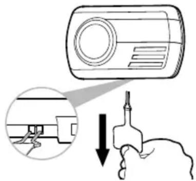 Diagram illustrating a hand holding a tool with a magnified view of the device's tip, showing a magnified view and directional arrow.