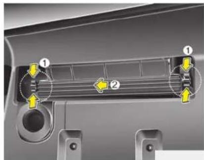 Diagram of a car air vent with labeled parts and directional arrows indicating flow or movement
