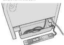 PANASONIC EP30102 - Stecken Sie das Bedienteil wieder in den Halter. - 1
