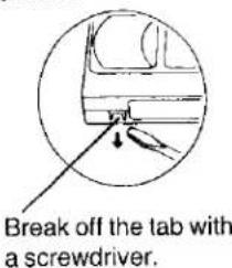Break off the tab with a screwdriver.