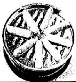 Nahaufnahme eines kreisförmigen Objekts mit radialen Blättern, das an eine stilisierte Sonne oder einen Mond erinnert (kein Text oder Symbole sichtbar)