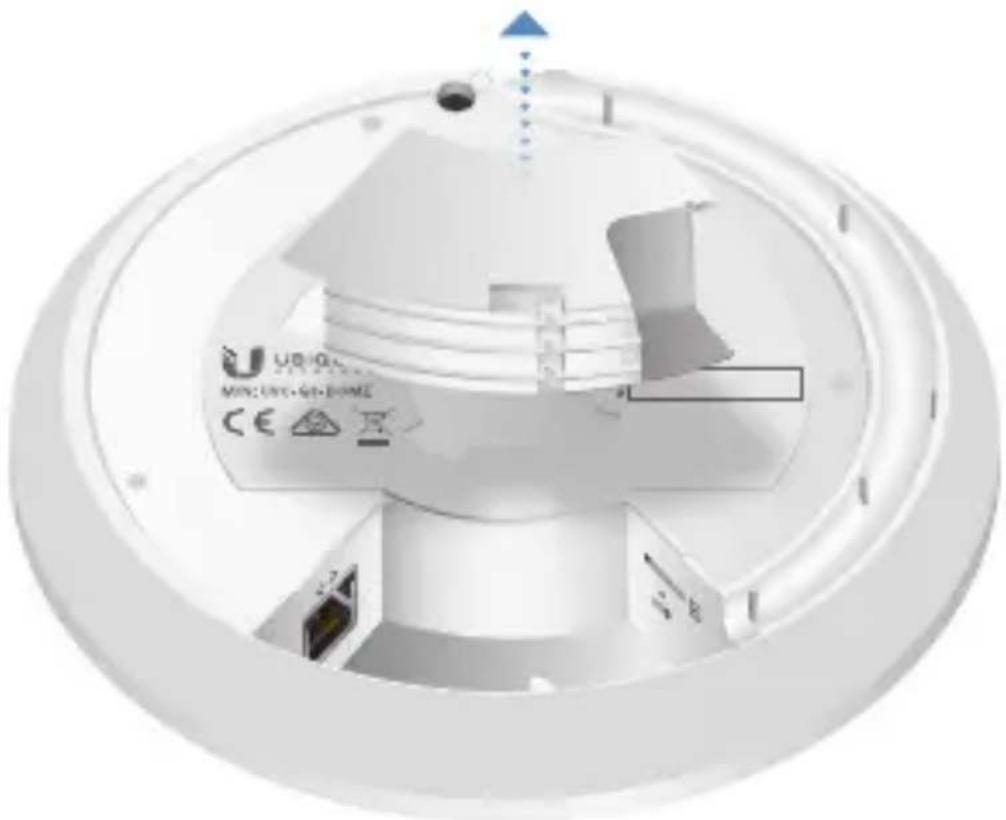 Cross-sectional view of a medical imaging device showing internal components and a blue arrow indicating direction (no readable text or symbols)